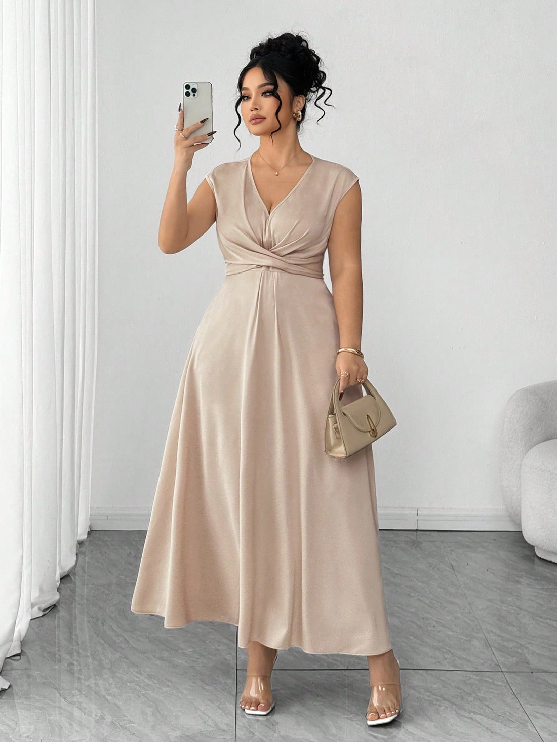 Slip into effortless sophistication with this stunning plus-size dress that celebrates curves in all the right ways. The dramatic batwing sleeves add a touch of flair while the flattering V-neckline draws the eye upward. The criss-cross waist design cinches beautifully, creating a gorgeous silhouette that's both comfortable and chic. Whether you're heading to brunch, a night out, or anywhere in between, this versatile piece proves that elegance has no size limit. Dress it up with heels or keep it casual—you