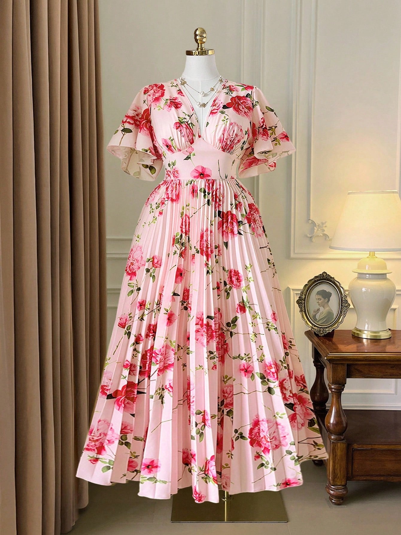 Step into effortless charm with this Elegant Plus Size V-Neck Pleated Maxi Dress. Featuring a flattering V-neck and breezy short sleeves, its delicate floral print and flowing pleats add a touch of whimsy to your look. Perfect for sunny days or garden parties, this dress combines comfort and style in a playful, flattering way.