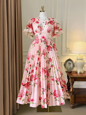 Step into effortless charm with this Elegant Plus Size V-Neck Pleated Maxi Dress. Featuring a flattering V-neck and breezy short sleeves, its delicate floral print and flowing pleats add a touch of whimsy to your look. Perfect for sunny days or garden parties, this dress combines comfort and style in a playful, flattering way.