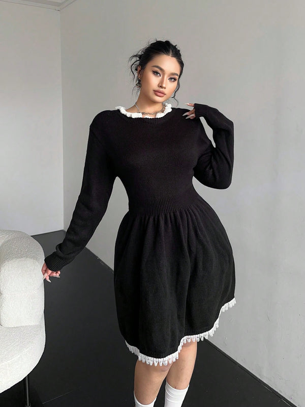Black plus size knit dress with pleated lace trim and umbrella-style skirt