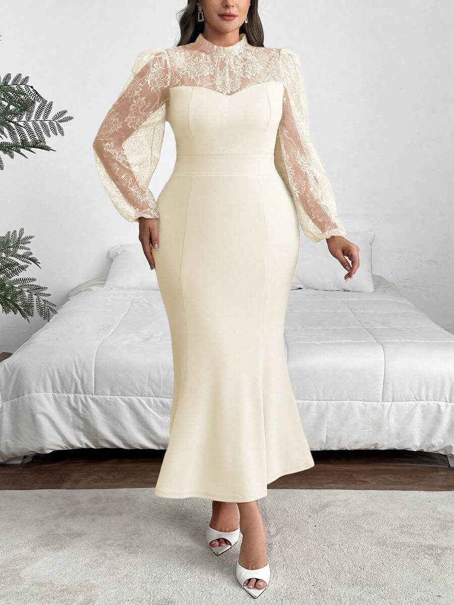 Make a statement at your graduation with this stunning plus-size dress that combines timeless elegance with modern flair. The delicate lace splice detail adds sophistication, while the dramatic mermaid hem creates a show-stopping silhouette. Playful lantern sleeves bring movement and dimension to the design, flattering your figure with style. Perfect for celebrating your big moment in confidence and grace.