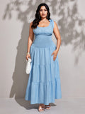 Step out in style with this Elegant Plus Size Women's Solid Smocked Ruffle Hem Sleeveless Dress. The smocked bodice offers a comfy, flattering fit, while the playful ruffle hem adds a flirty touch. Perfect for sunny days or casual outings, this dress combines comfort and charm effortlessly. Embrace your curves and let your confidence shine!