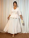 Elevate your formal wardrobe with this stunning two-piece set designed for the modern woman! The soft apricot V-neck shirt drapes beautifully, offering both comfort and sophistication, while the floral-cinched skirt adds a touch of romantic flair. Perfect for weddings, galas, or special celebrations, this plus-size ensemble combines timeless elegance with contemporary style. The cinched waist flatters your silhouette while the coordinated pieces create an effortlessly polished look. Dress it up with heels a