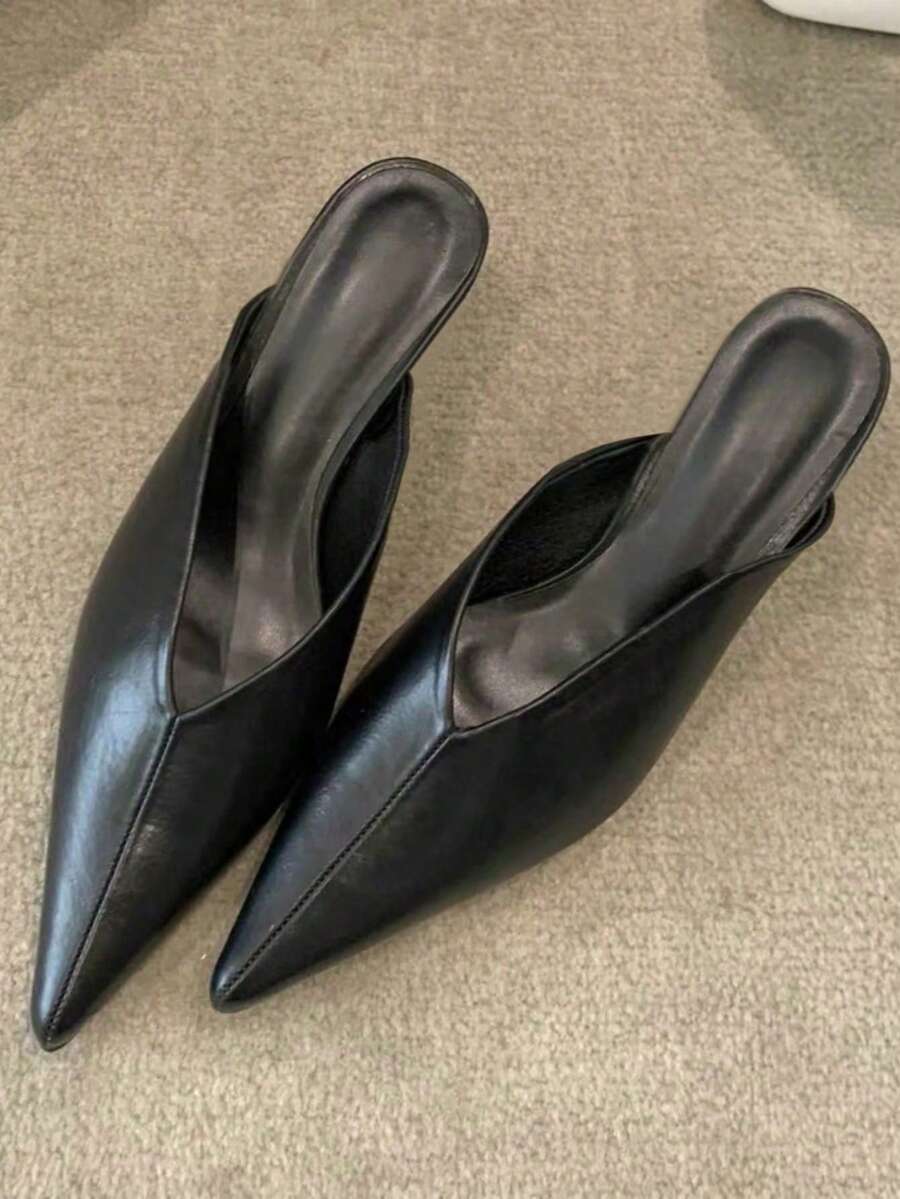 Step into sophistication with these stunning pointed-toe mule sandals, your new go-to for elevating any fall-winter ensemble. The sleek silhouette pairs beautifully with everything from cocktail dresses to chic trousers, while the gleaming metal buckle detail adds just the right touch of glamour. Designed for those who refuse to compromise on style, these mules deliver comfort without sacrificing that head-turning polish. Whether you're heading to a holiday party or a night out with friends, slip them on an