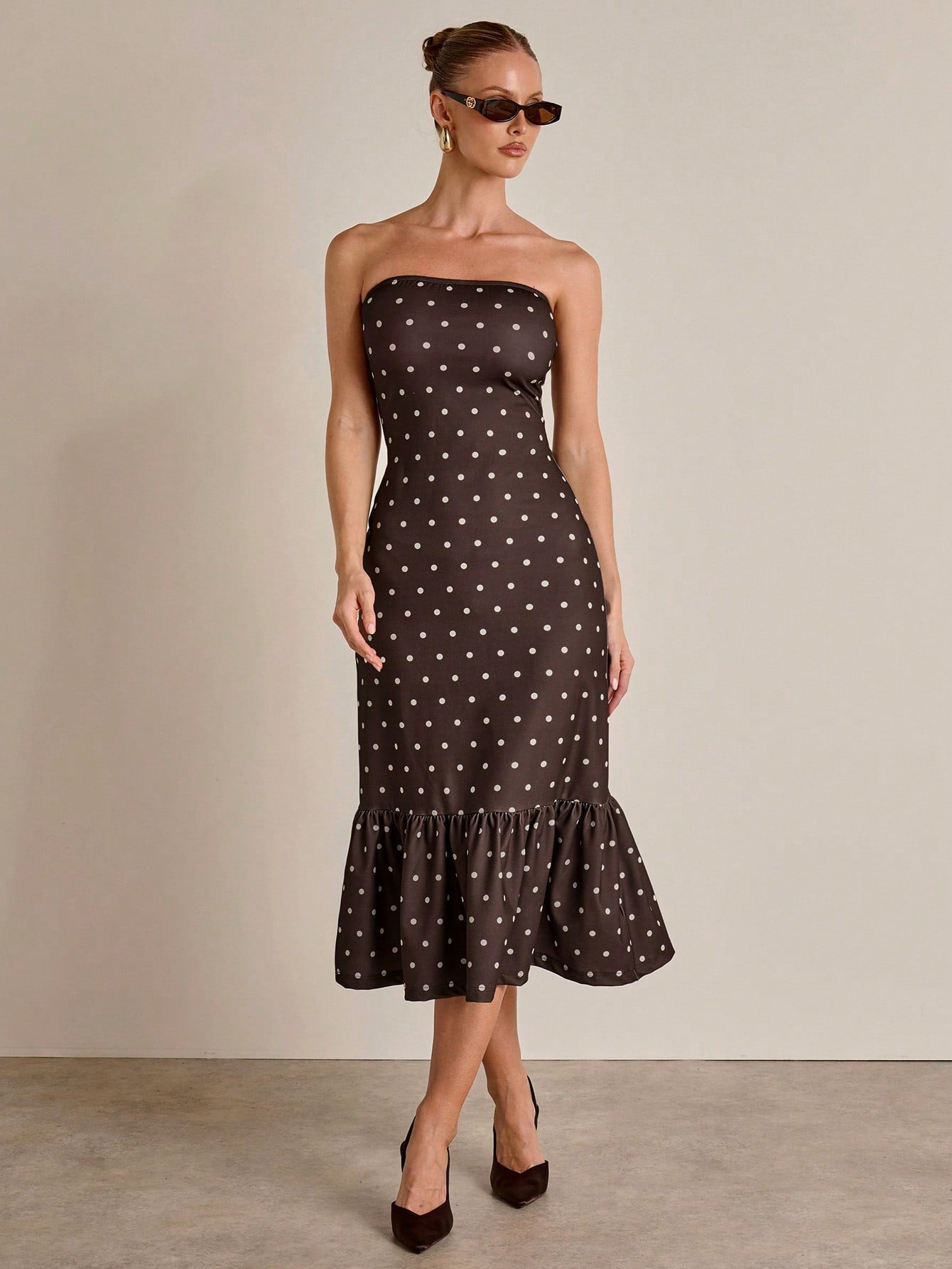 Twirl into sophistication with this charming polka dot dress that's equal parts fun and fabulous. The fitted silhouette hugs your curves in all the right ways, while the dramatic fishtail hem adds a flirty flourish that turns heads. Perfect for date nights, brunch dates, or whenever you want to feel like the best-dressed person in the room. This playful piece proves that timeless polka dots never go out of style—they just get better with a modern twist.