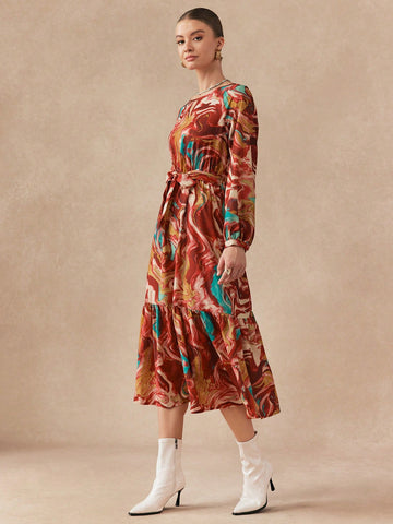 Twirl into autumn in this stunning printed long dress that's equal parts sophisticated and fun. The graceful round neckline frames your face beautifully, while the flowing silhouette glides with every step. Perfect for everything from casual coffee dates to evening gatherings, this versatile piece brings effortless elegance to your fall wardrobe. The eye-catching print adds personality without sacrificing that polished, put-together vibe you're after. Slip it on and feel the confidence boost that comes with