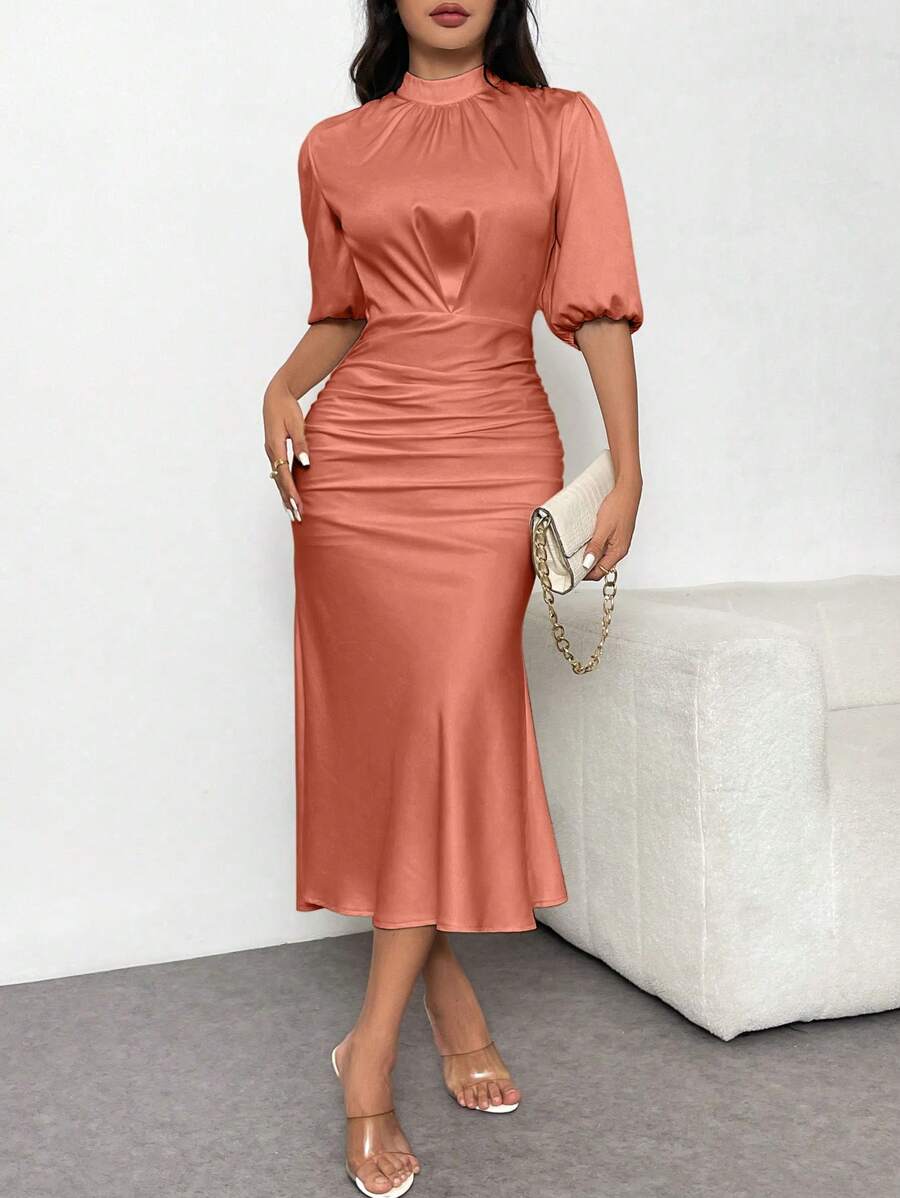 Unleash your inner mermaid in this elegant puff sleeve maxi dress. Made from luxurious satin, this dress cinches at the waist for a flattering silhouette. Perfect for any occasion, it's the ultimate statement piece for the fashion-forward woman. (Just try to resist twirling in it - we dare you!)