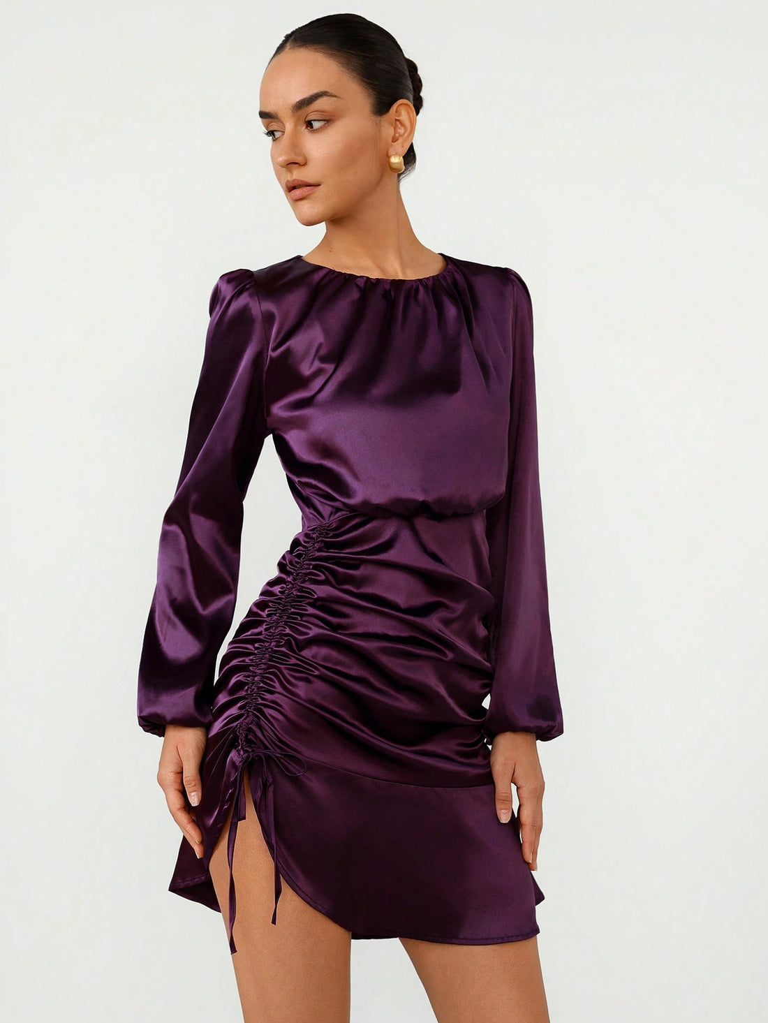 Turn heads this fall in this Elegant Purple Faux Silk Bodycon Mini Dress. With its playful asymmetrical ruffles and luxe faux silk sheen, it’s perfect for parties that call for a little extra flair. Hugging your silhouette just right, this dress blends comfort with chic for effortless style all season long.
