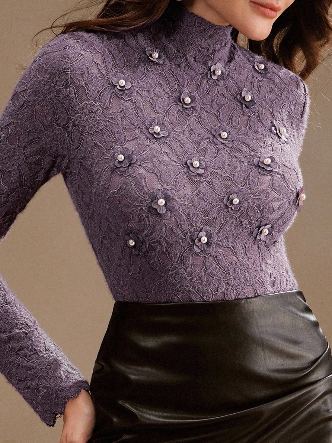 Elevate your everyday style with this charming purple floral lace turtleneck—where romance meets practicality. The delicate lace detailing adds a touch of whimsy, while the fitted turtleneck keeps you cozy and chic. Perfect as a standalone statement piece or layered under your favorite sweater, this tee brings personality to any outfit. Whether you're channeling vintage vibes or modern elegance, this playful essential proves that base layers don't have to be boring. Slip it on and let your romantic side shi