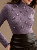 Elevate your everyday style with this charming purple floral lace turtleneck—where romance meets practicality. The delicate lace detailing adds a touch of whimsy, while the fitted turtleneck keeps you cozy and chic. Perfect as a standalone statement piece or layered under your favorite sweater, this tee brings personality to any outfit. Whether you're channeling vintage vibes or modern elegance, this playful essential proves that base layers don't have to be boring. Slip it on and let your romantic side shi