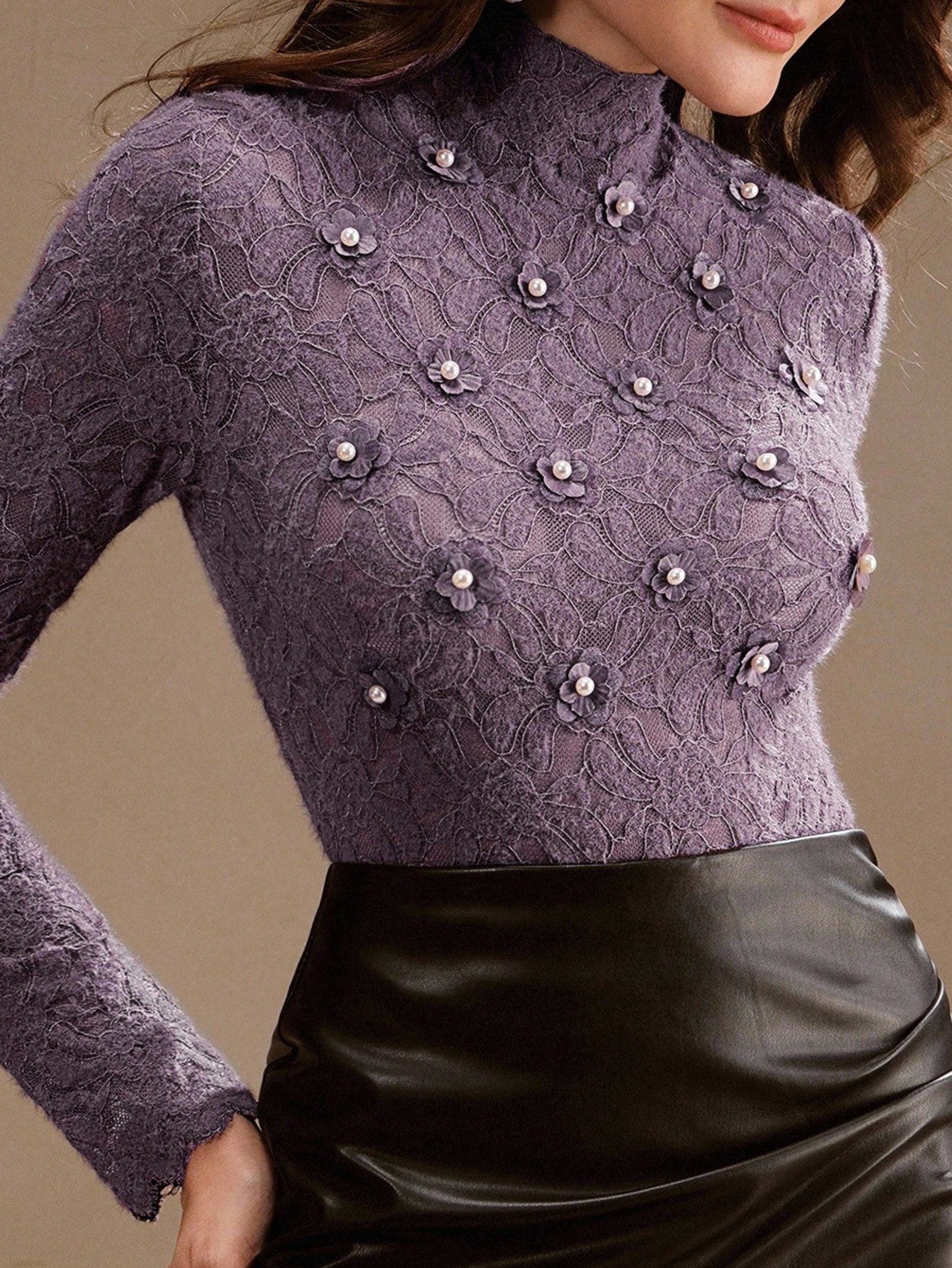 Elevate your everyday style with this charming purple floral lace turtleneck—where romance meets practicality. The delicate lace detailing adds a touch of whimsy, while the fitted turtleneck keeps you cozy and chic. Perfect as a standalone statement piece or layered under your favorite sweater, this tee brings personality to any outfit. Whether you're channeling vintage vibes or modern elegance, this playful essential proves that base layers don't have to be boring. Slip it on and let your romantic side shi