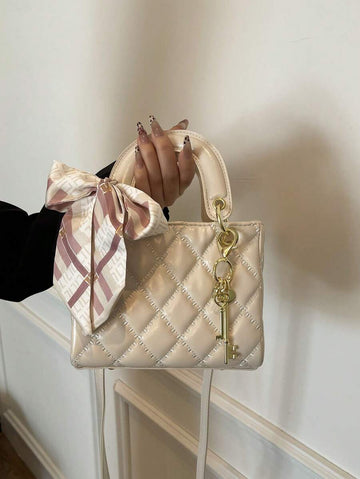 Elevate your everyday style with this chic quilted PU handbag that seamlessly transitions from boardroom to brunch. The sophisticated quilted texture paired with a delicate pendant charm adds just the right touch of personality to any outfit. Designed as a crossbody bag, it keeps your hands free while you conquer your day—whether you're juggling work meetings or weekend adventures. The versatile silhouette works with virtually any wardrobe, making it the ultimate go-anywhere companion. Looking for the perfe