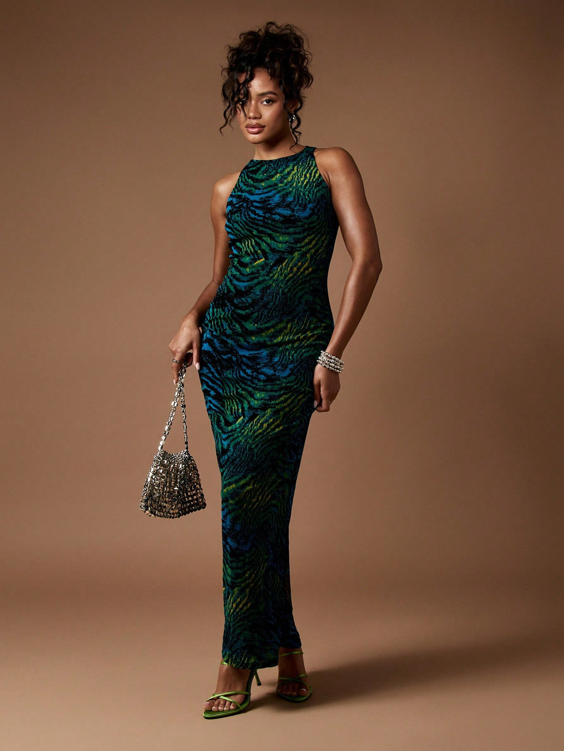 Step into the spotlight with this Elegant Racerback Animal Print Maxi Dress, your go-to gown for dazzling party nights and chic wedding celebrations. Designed for fall and winter, its flowing silhouette and bold animal pattern add a wild twist to your festive wardrobe. The racerback cut keeps it flirty and fun, making you feel confidently stunning wherever you go. Embrace the season with a look that’s fierce, fabulous, and utterly unforgettable.