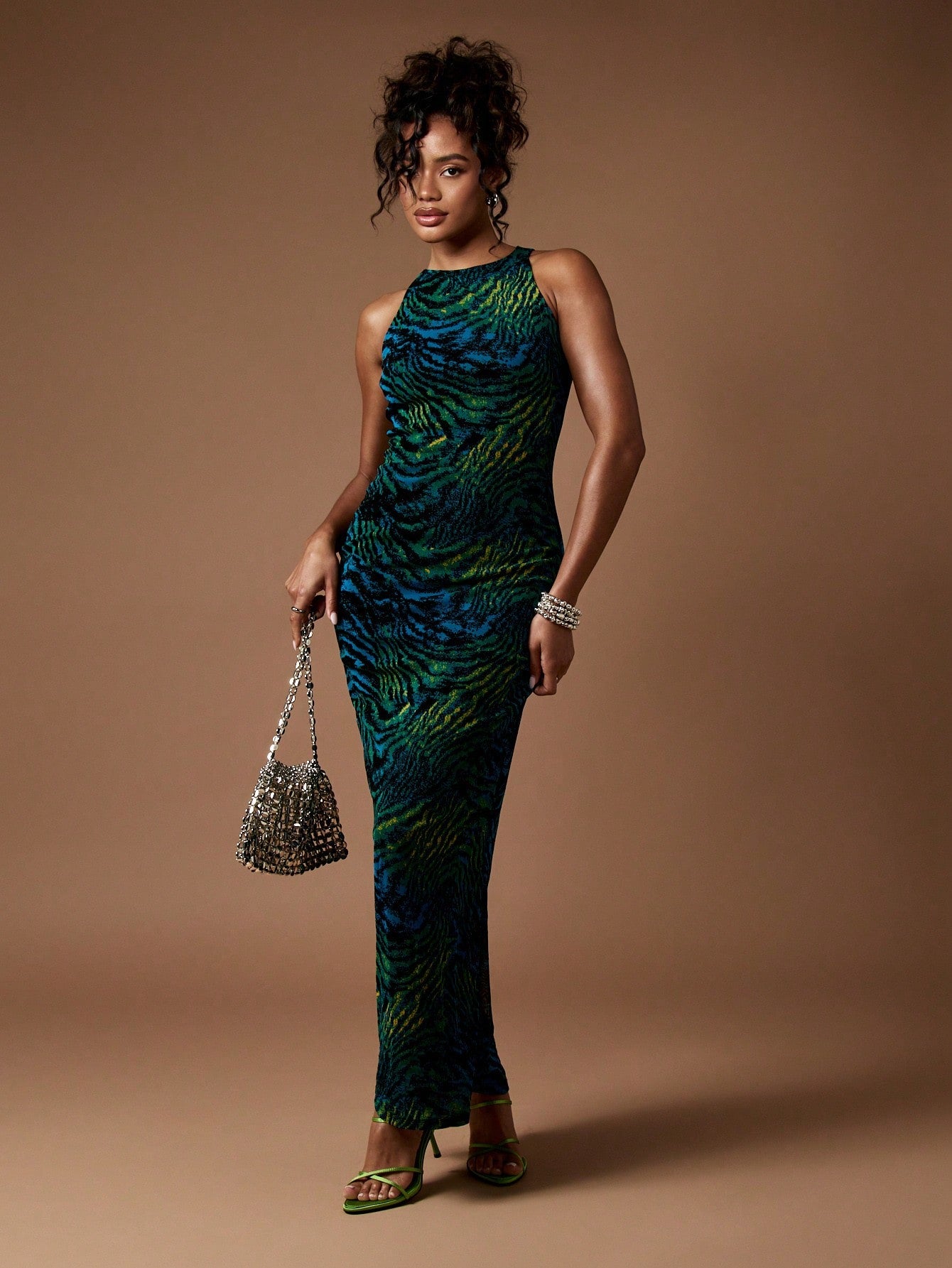 Step into the spotlight with this Elegant Racerback Animal Print Maxi Dress, your go-to gown for dazzling party nights and chic wedding celebrations. Designed for fall and winter, its flowing silhouette and bold animal pattern add a wild twist to your festive wardrobe. The racerback cut keeps it flirty and fun, making you feel confidently stunning wherever you go. Embrace the season with a look that’s fierce, fabulous, and utterly unforgettable.
