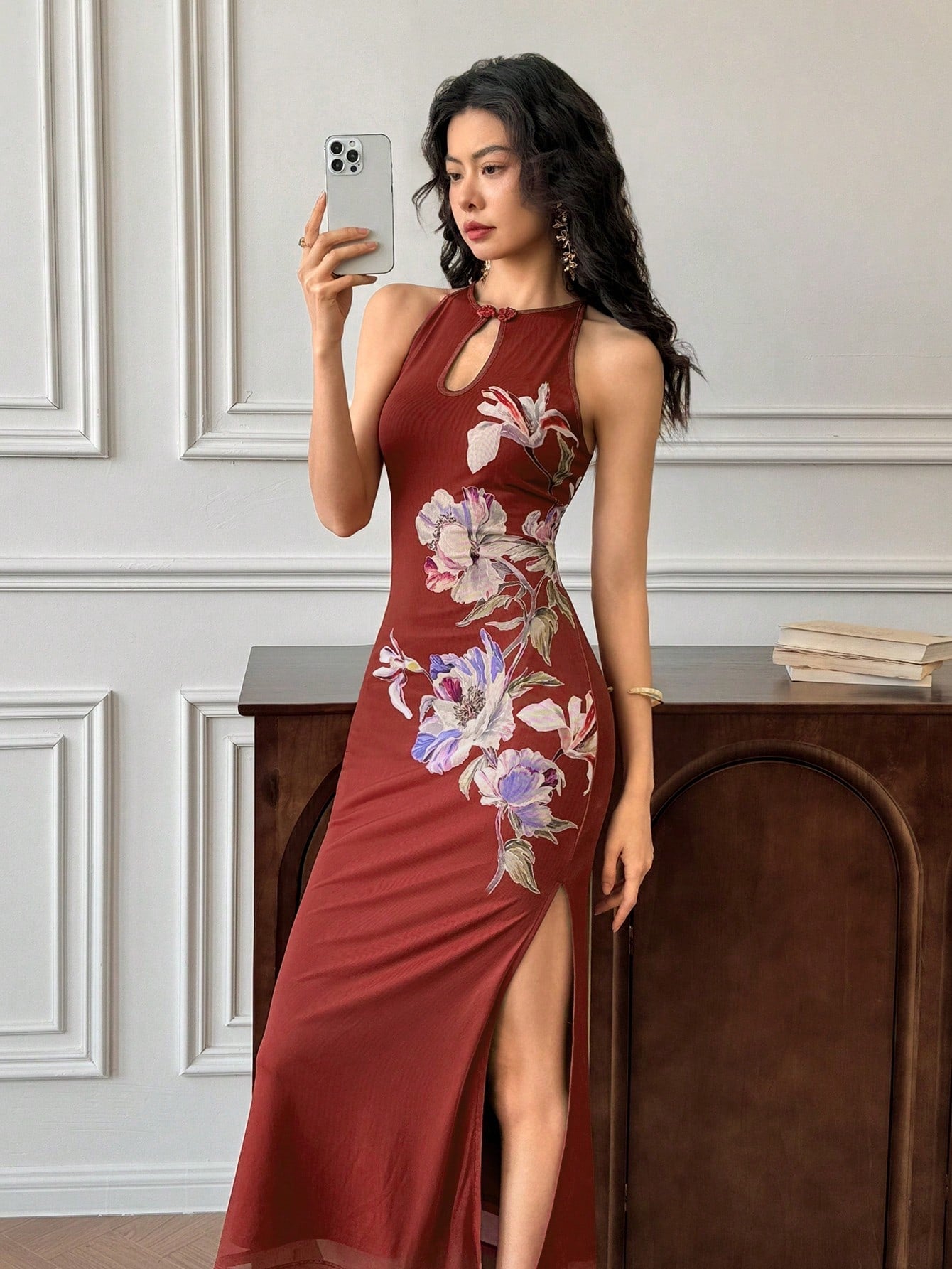 Step into the spotlight with this playful red cheongsam, featuring a flattering halter neck and a daring side slit that adds just the right amount of sass. Perfect for wedding dates, its elegant cut embraces tradition with a modern twist, letting you move freely while turning heads. Make every moment unforgettable in this chic and spirited dress.