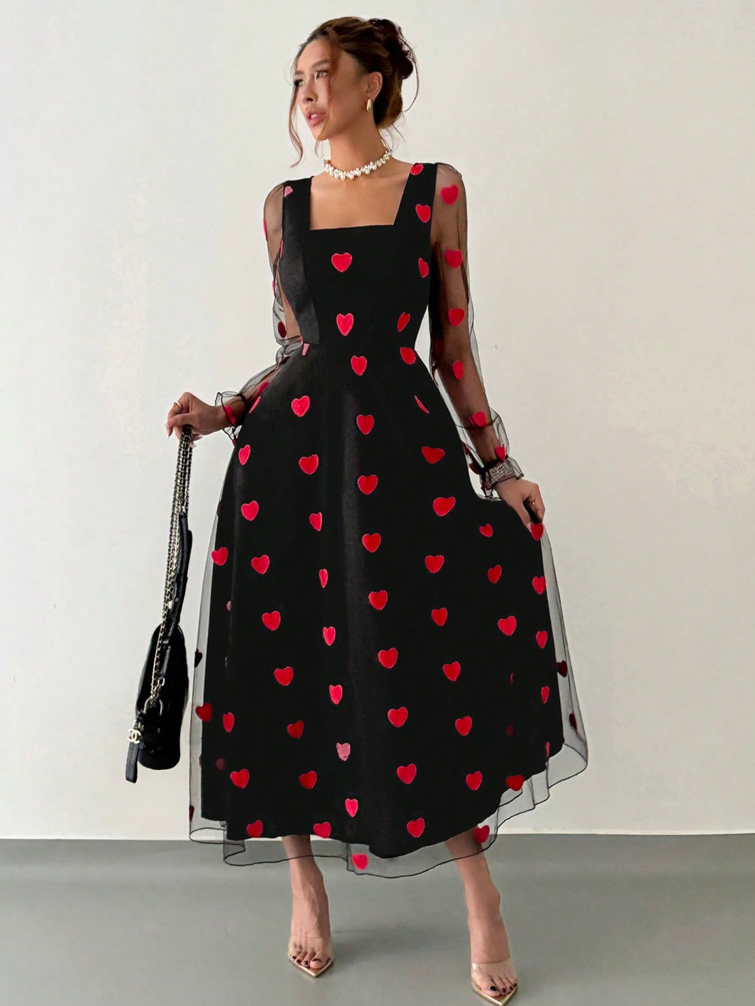 Elevate your wardrobe with this striking red mesh dress, designed to make a sophisticated statement. The heart-shaped silhouette flatters your figure while the distinctive lotus leaf sleeves add an artistic, fashion-forward touch. Crafted from quality mesh fabric, this piece transitions seamlessly from romantic evenings to elevated everyday styling. The thoughtful design balances elegance with modern flair, making it a versatile addition to any collection. Perfect for those who appreciate distinctive detail