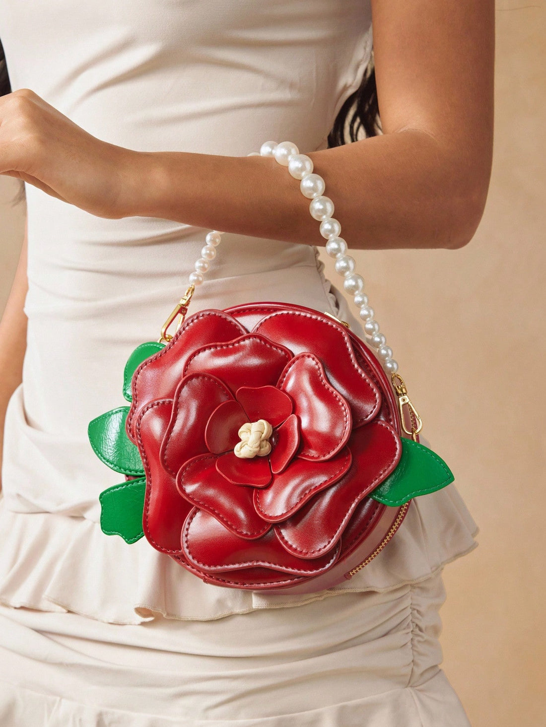 Add a splash of charm to your outfit with this playful red pearl handbag! Shaped like a delicate flower and crafted from smooth PU leather, it’s the perfect little top handle bag to brighten up parties or special occasions. Compact yet eye-catching, this unique accessory brings a fun and elegant twist wherever you go.