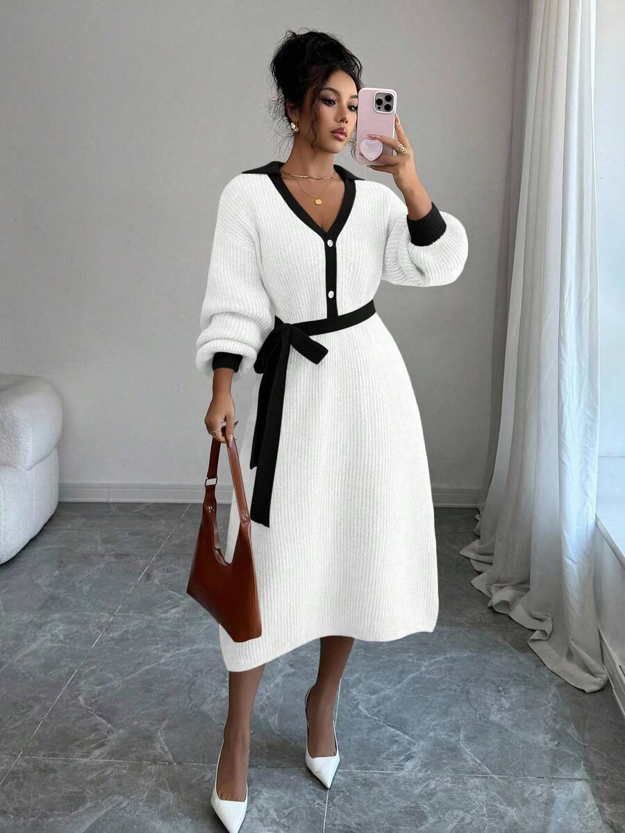 Front view of white and black belted polo collar knit midi dress with bishop sleeves and button front