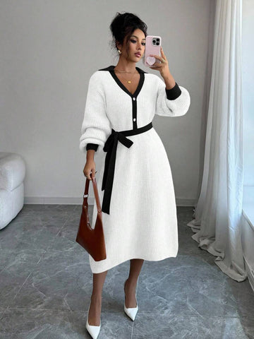 Front view of white and black belted polo collar knit midi dress with bishop sleeves and button front