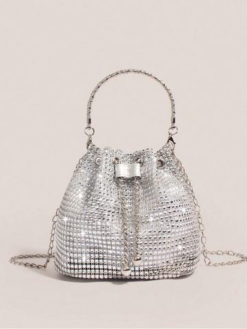 Elevate your everyday carry with this stunning gold bucket tote that's equal parts glamorous and practical. Adorned with shimmering rhinestone embellishments, it catches the light beautifully whether you're heading to the office, jetting off on an adventure, or making an entrance at your next event. The spacious bucket silhouette keeps your essentials organized while the polished gold finish adds that touch of sophistication you've been craving. Versatile enough to transition from day to night, this tote is