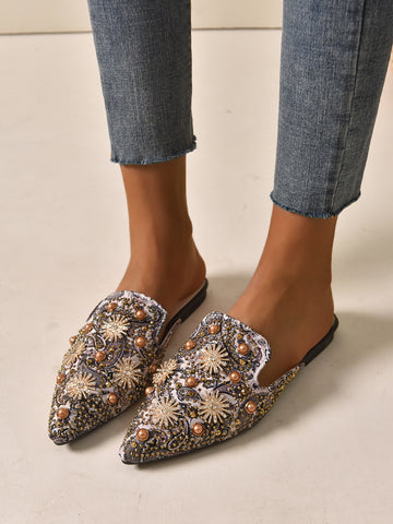 Looking for glam and comfort for the big day? These mule flats have got you covered! Elegant rhinestones add the perfect touch of sparkle, while the faux pearls add a touch of vintage charm. Perfect for weddings and parties, these flats will keep you dancing all night long!