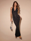 Be the center of attention in this Elegant Rhinestone Backless Halter Dress for Women! The chic fashion statement will turn heads with its dazzling rhinestone details and alluring backless design. Stand out and show off your unique style in this stunning dress.
