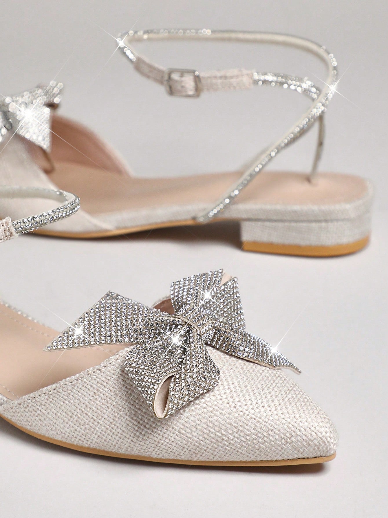 Step out in style with these Elegant Rhinestone Bow Ankle Strap Ballet Flats! Featuring a chic almond toe and sparkling rhinestone bow, they add a touch of glam to any outfit. The ankle strap keeps them snug and comfy, perfect for dancing through your day with a playful bounce.