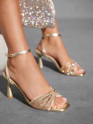 Step into the spotlight with these Elegant Rhinestone Bow High Heel Sandals! Sparkling rhinestones and a charming bow add a touch of whimsy, perfect for weddings or lively parties. These heels combine style and flair to make every step a statement of fun and fashion.