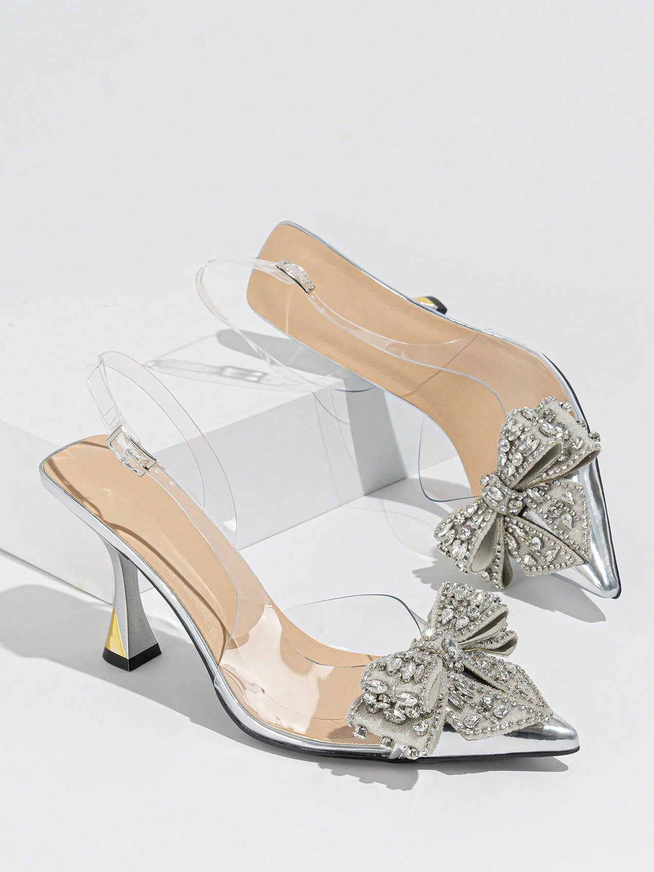 The perfect addition to any party or dance ensemble, these Elegant Rhinestone Bowknot Stiletto Heels exude sophistication and style. The rhinestone detailing and delicate bowknot add a touch of elegance, while the stiletto heel provides height and a sleek silhouette. Ideal for any special occasion, these heels are sure to elevate your look.