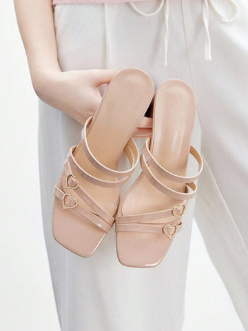 Step into the season with sparkle and sass! These elegant rhinestone heart heeled sandals blend festive glamour with everyday wearability. The shimmering heart embellishments catch the light beautifully, while the comfortable heel height keeps you poised whether you're holiday shopping or heading to work. Perfect for adding a touch of chic sophistication to your commuting wardrobe this Christmas. Dress them up for parties or down with casual outfits—these versatile beauties do it all with style.