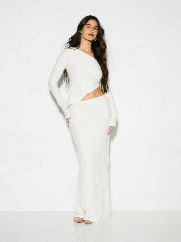 Make a statement at your next winter celebration with this chic two-piece set that's equal parts cozy and glamorous. The ribbed crop sweater top features a textured long sleeve design that hugs in all the right places, while the flowing maxi skirt adds an effortless elegance. Whether you're heading to a winter wedding or special occasion, this pairing strikes the perfect balance between comfort and sophistication. Dress it up with heels and jewelry, or keep it casual for a night out. Because looking fabulou