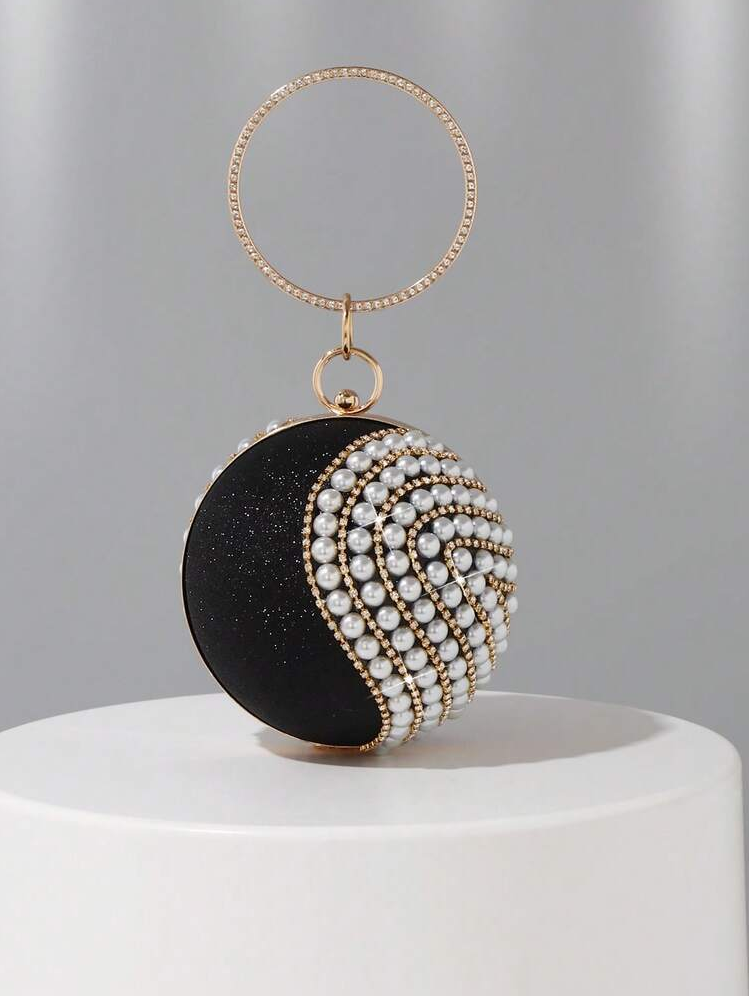 Elevate your evening look with this stunning round clutch, crafted in lustrous gold with intricate diamond detailing. Adorned with shimmering rhinestones and lustrous pearls, this sophisticated accessory catches the light beautifully and adds instant glamour to any formal ensemble. Perfect for weddings, proms, galas, and special occasions, this clutch combines timeless elegance with modern sparkle. The compact round design fits essentials while making a statement. 