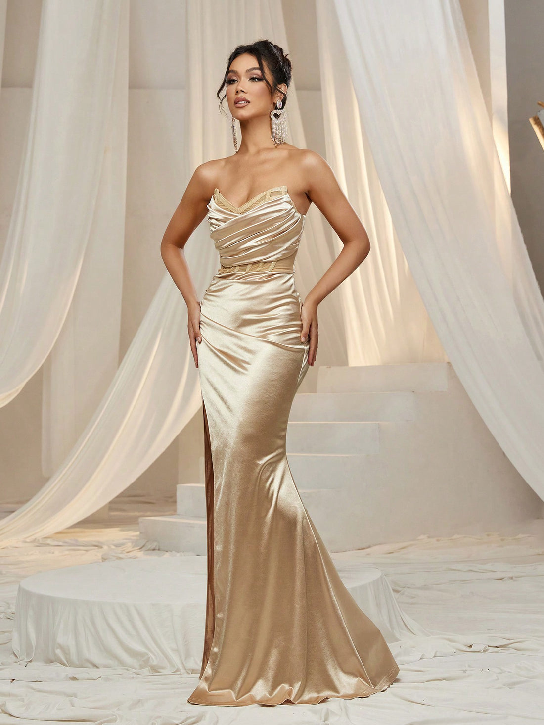 Turn heads all night in this Elegant Ruched Front Satin Tube Party Dress. The smooth satin fabric hugs your curves with a flattering ruched front, while the daring thigh split adds a touch of sass to your look. Perfect for dancing, cocktails, or any unforgettable evening, this dress combines comfort with show-stopping style for your most stunning party moments.