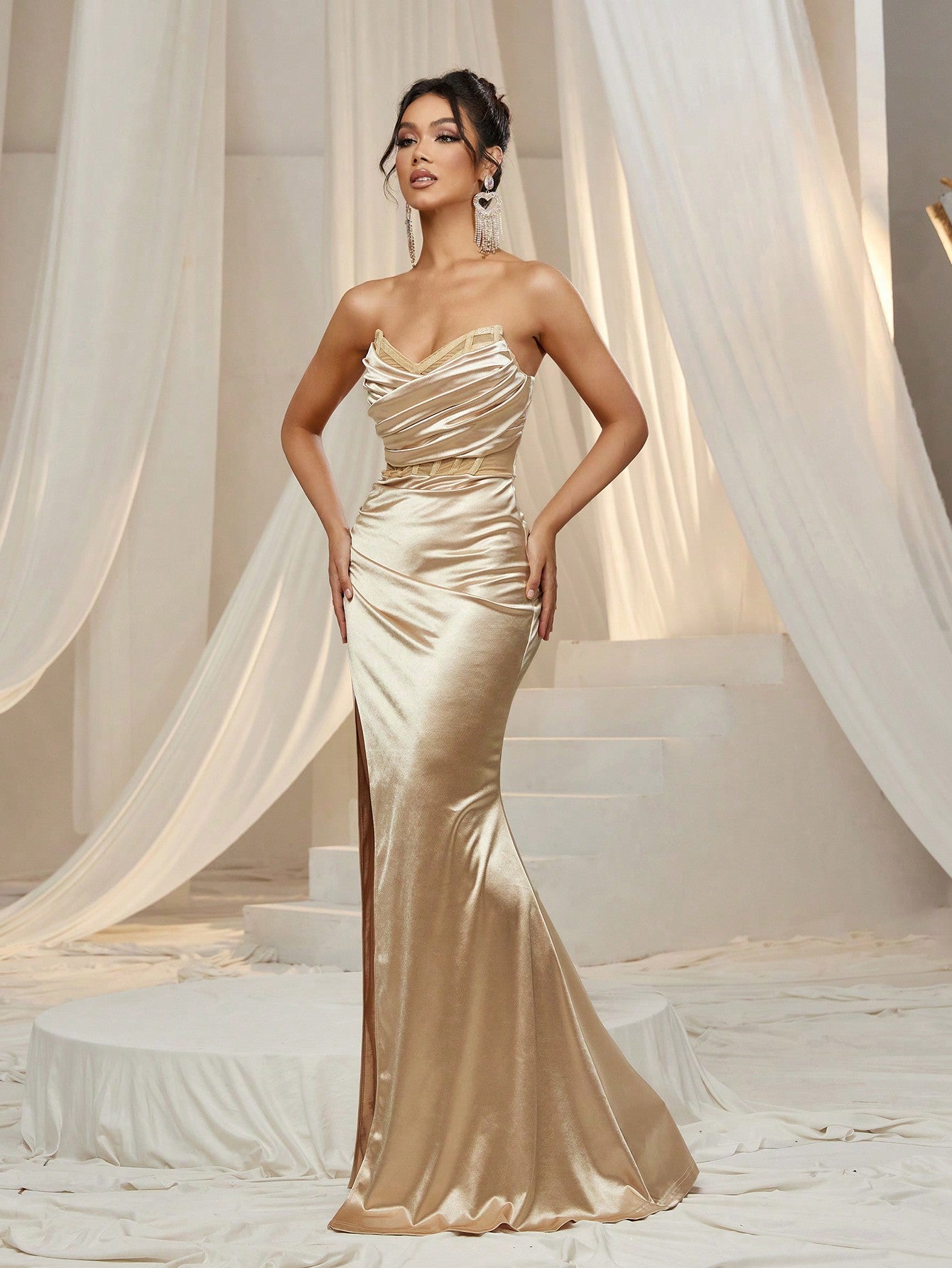 Turn heads all night in this Elegant Ruched Front Satin Tube Party Dress. The smooth satin fabric hugs your curves with a flattering ruched front, while the daring thigh split adds a touch of sass to your look. Perfect for dancing, cocktails, or any unforgettable evening, this dress combines comfort with show-stopping style for your most stunning party moments.