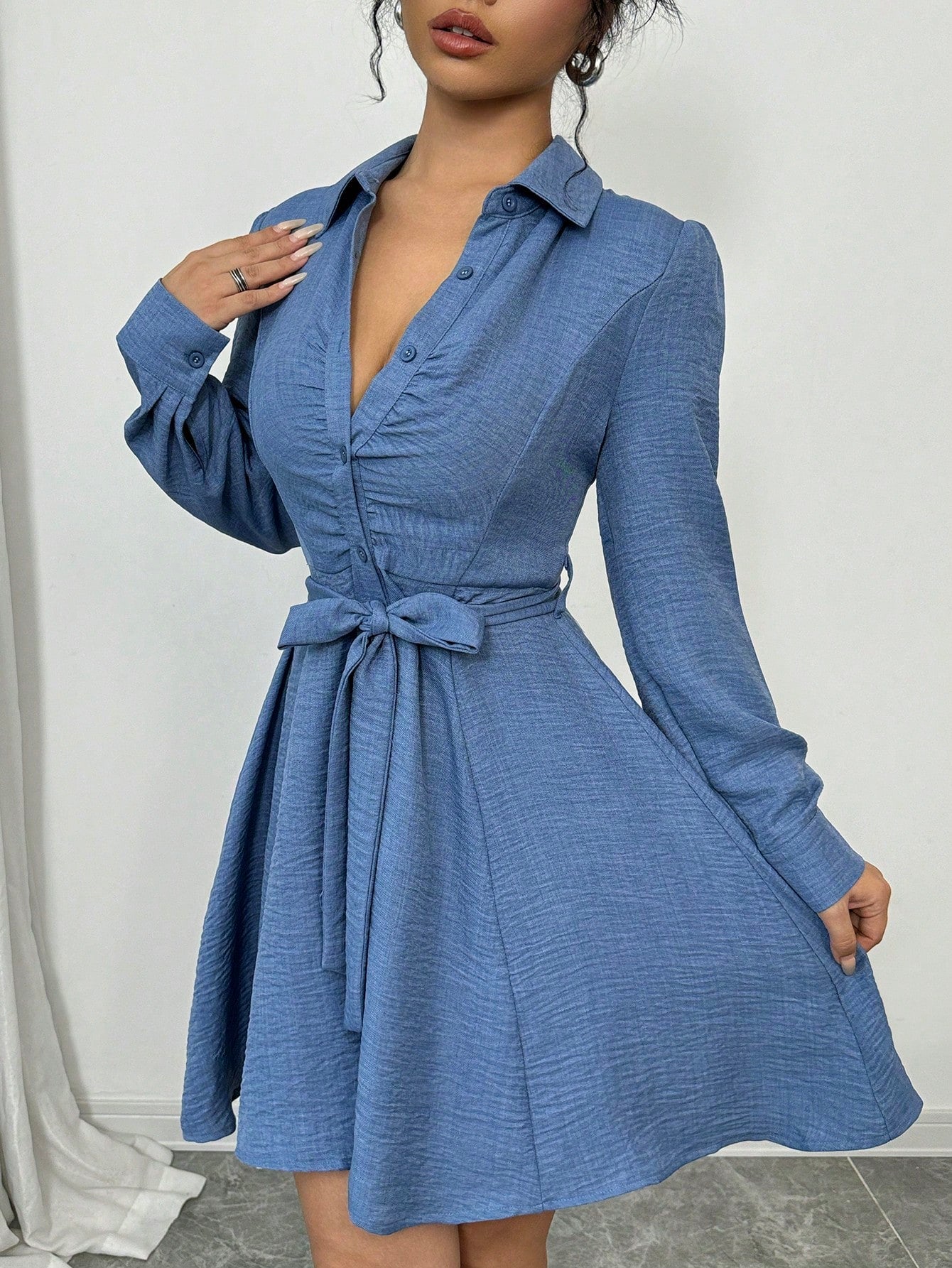 Add a touch of elegance to any occasion with our Elegant Ruched Waist Long Sleeve Dress. Featuring a flattering ruched waist and stylish front buttons, this dress is perfect for any formal event or night out. Stay comfortable and fashionable in this timeless and versatile piece.