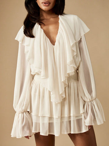 Twirl into spring and summer celebrations in this enchanting ruffle mini dress! Crafted from lightweight, flowing chiffon, this dress features charming balloon sleeves that add a whimsical touch to your special occasion look. The delicate ruffled details create movement and dimension, perfect for weddings, garden parties, and romantic getaways. Whether you're a guest or the star of the show, this playful piece brings effortless elegance and a hint of fun to any warm-weather event. Pair it with strappy heels