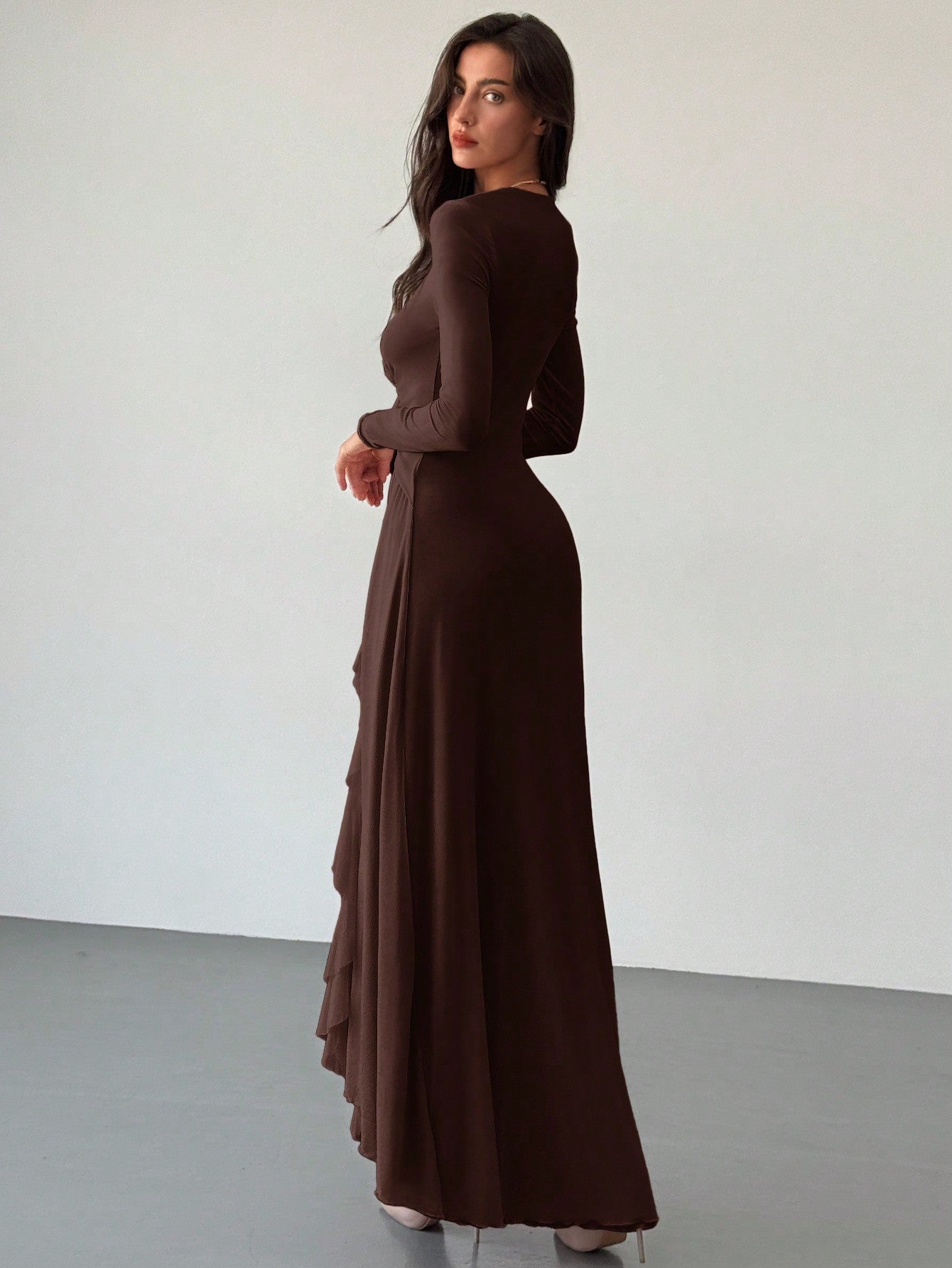 Unleash your inner romance with this elegant and playful dress featuring ruffled floral accents and a plunging v-neck. Perfect for a date night or special occasion, this sheer dress will make you feel beautiful and confident. Embrace your unique style and stand out in a crowd!