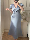 Get ready to shake up your spring/summer wardrobe with our Elegant Satin Blue Knot Dress! The unique ruffled flared sleeves add a touch of whimsy to the elegant satin fabric. Perfect for any occasion, this dress will have you feeling like a true fashionista. (And yes, it is as comfortable as it is stylish!)