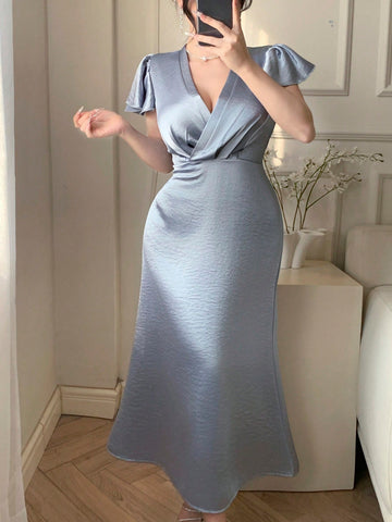 Get ready to shake up your spring/summer wardrobe with our Elegant Satin Blue Knot Dress! The unique ruffled flared sleeves add a touch of whimsy to the elegant satin fabric. Perfect for any occasion, this dress will have you feeling like a true fashionista. (And yes, it is as comfortable as it is stylish!)