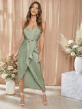 Experience elegance and sophistication with our Elegant Satin Cami Bridesmaid Dress. Featuring a stunning tie front and wrap hem, this dress is sure to impress. Made with luxurious satin, it drapes beautifully and is perfect for any formal occasion. Elevate your bridesmaids' style with this timeless and chic piece.