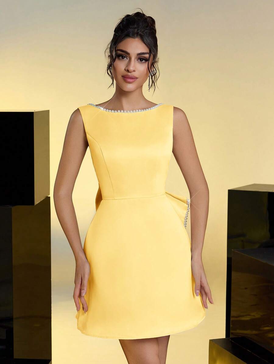 Step into the spotlight with this Elegant Satin Faux Pearl Bow Backless Party Dress. Its silky satin fabric and delicate faux pearl bow add a touch of charm, while the backless design keeps things flirty and fun. Perfect for galas, weddings, or special dates, this dress promises to make every moment unforgettable. Dance, twirl, and shine with effortless style!