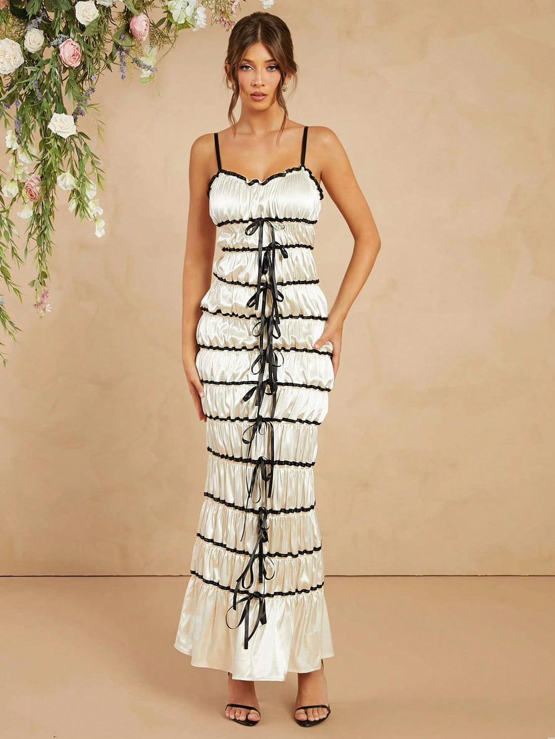 Step into the spotlight with this Elegant Satin Maxi Cami Dress, featuring a charming bow ribbon detail that adds a touch of flirtiness to your look. Its smooth satin fabric flows effortlessly, making it perfect for any chic occasion where you want to feel dazzling and comfortable. Whether you’re dancing the night away or enjoying a stylish soirée, this dress blends sophistication with playful charm.