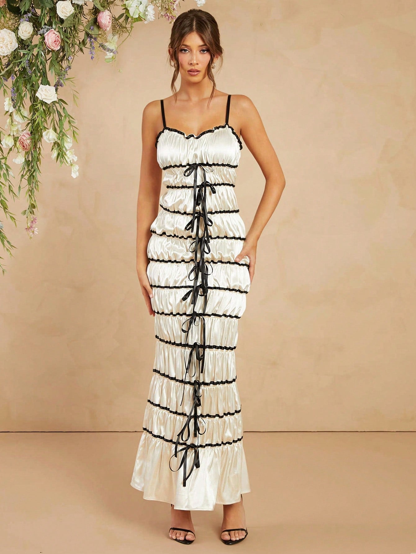 Step into the spotlight with this Elegant Satin Maxi Cami Dress, featuring a charming bow ribbon detail that adds a touch of flirtiness to your look. Its smooth satin fabric flows effortlessly, making it perfect for any chic occasion where you want to feel dazzling and comfortable. Whether you’re dancing the night away or enjoying a stylish soirée, this dress blends sophistication with playful charm.