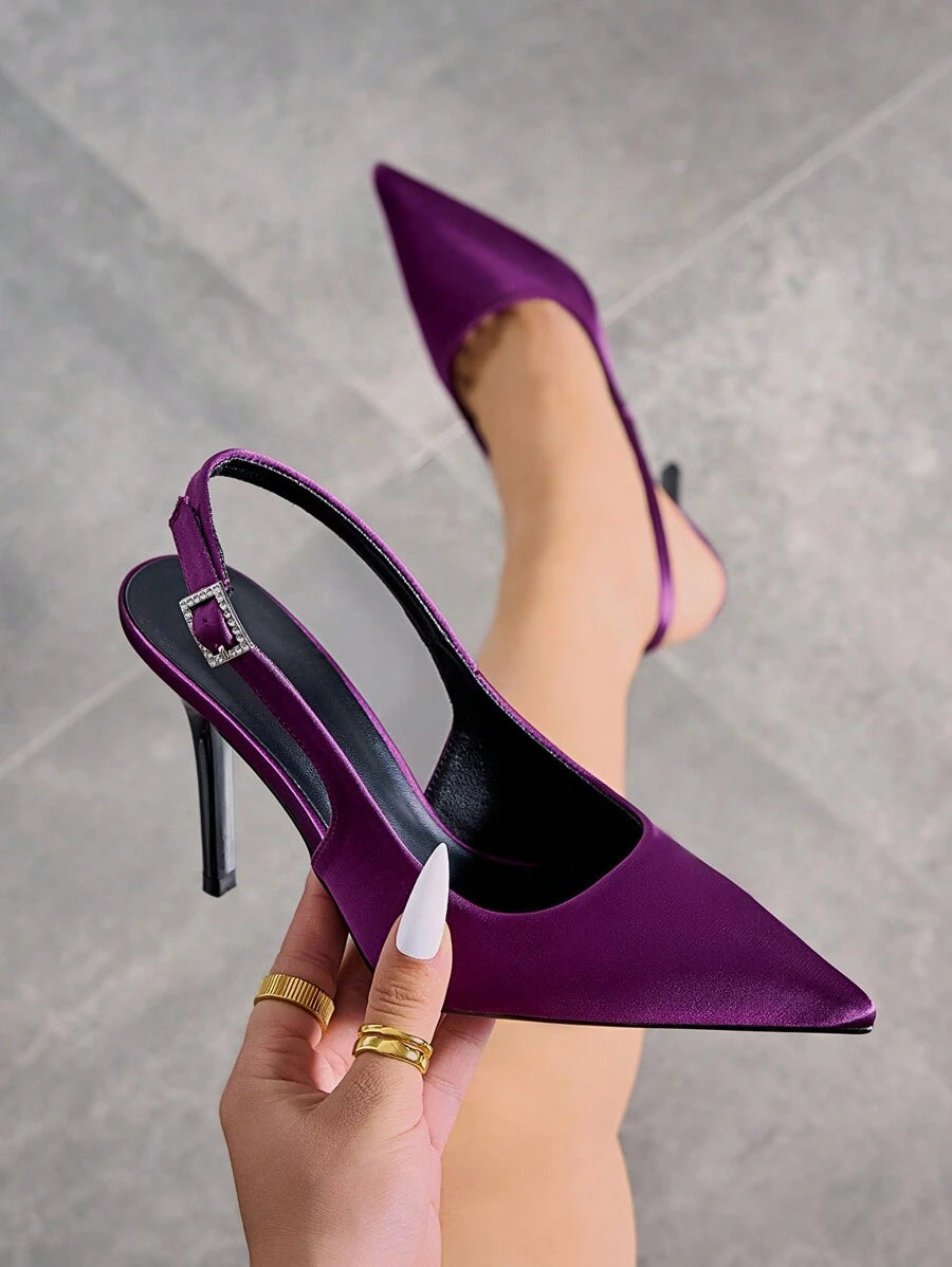 Step into sophistication with these stunning satin open heel backstrap high heels. Featuring a sleek pointed toe and elegant stiletto heel, they're designed to turn heads at any occasion. The secure buckle closure and slingback strap provide comfort and stability, while the luxurious satin finish adds a touch of glamour. Perfect for parties, celebrations, and special events, these purple court pumps deliver a chic, sexy silhouette that complements any evening ensemble. Note: Runs half-size smaller for an op