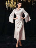 Add a touch of elegance to your wardrobe with our Satin V-Neck Belted Maxi Dress. The soft satin fabric drapes beautifully, while the belted waist cinches in for a flattering silhouette. Its long sleeves make it the perfect choice for any occasion. (Style and comfort in one? Non-tacky satin? Yes, please!)