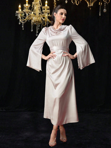 Add a touch of elegance to your wardrobe with our Satin V-Neck Belted Maxi Dress. The soft satin fabric drapes beautifully, while the belted waist cinches in for a flattering silhouette. Its long sleeves make it the perfect choice for any occasion. (Style and comfort in one? Non-tacky satin? Yes, please!)