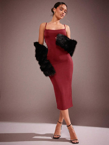 Turn heads this Valentine's Day and all summer long in this sleek sleeveless midi dress. Featuring a daring low back and a captivating twist detail, it perfectly blends elegance with a hint of flirtation. The flattering silhouette offers just the right touch of sexiness, making it your go-to piece for warm, romantic evenings or stylish daytime outings. Feel confident, chic, and effortlessly playful wherever you wear it.