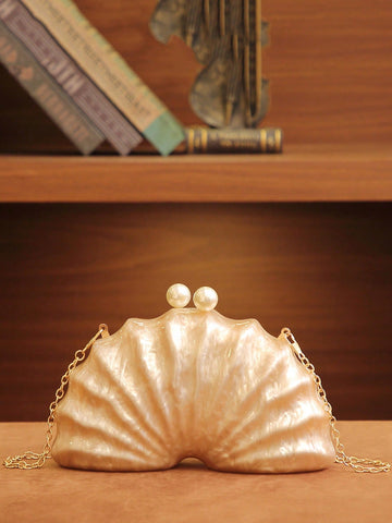 Make a splash at every celebration with this Elegant Shell-Shaped Acrylic Evening Clutch! Its unique shell design brings a touch of whimsy, while the detachable chain lets you switch between hands-free convenience and chic clutch style. Perfect for weddings and parties, this standout accessory keeps your essentials close with playful sophistication. Dive into fun and functional fashion wherever you go!