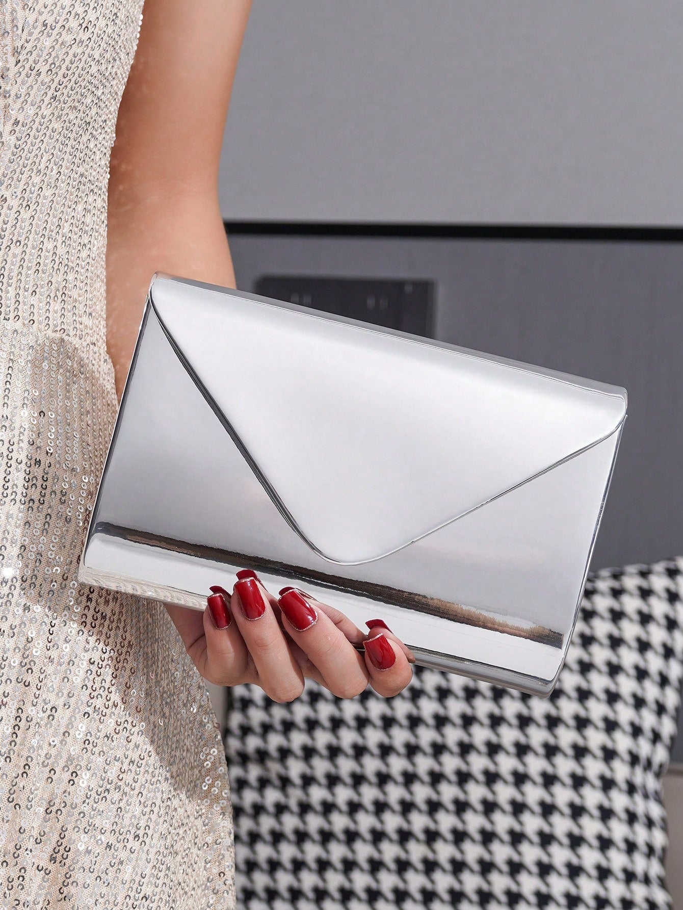 Shine bright wherever you go with this Elegant Silver Metallic Clutch Bag! Crafted from glossy PU leather, it’s the perfect playful accessory to keep your phone and lipstick close. Its sleek design adds a dash of sparkle to any outfit, making it easy to switch from day to night with style and ease. Compact yet roomy enough for essentials, this clutch is ready to party with you!