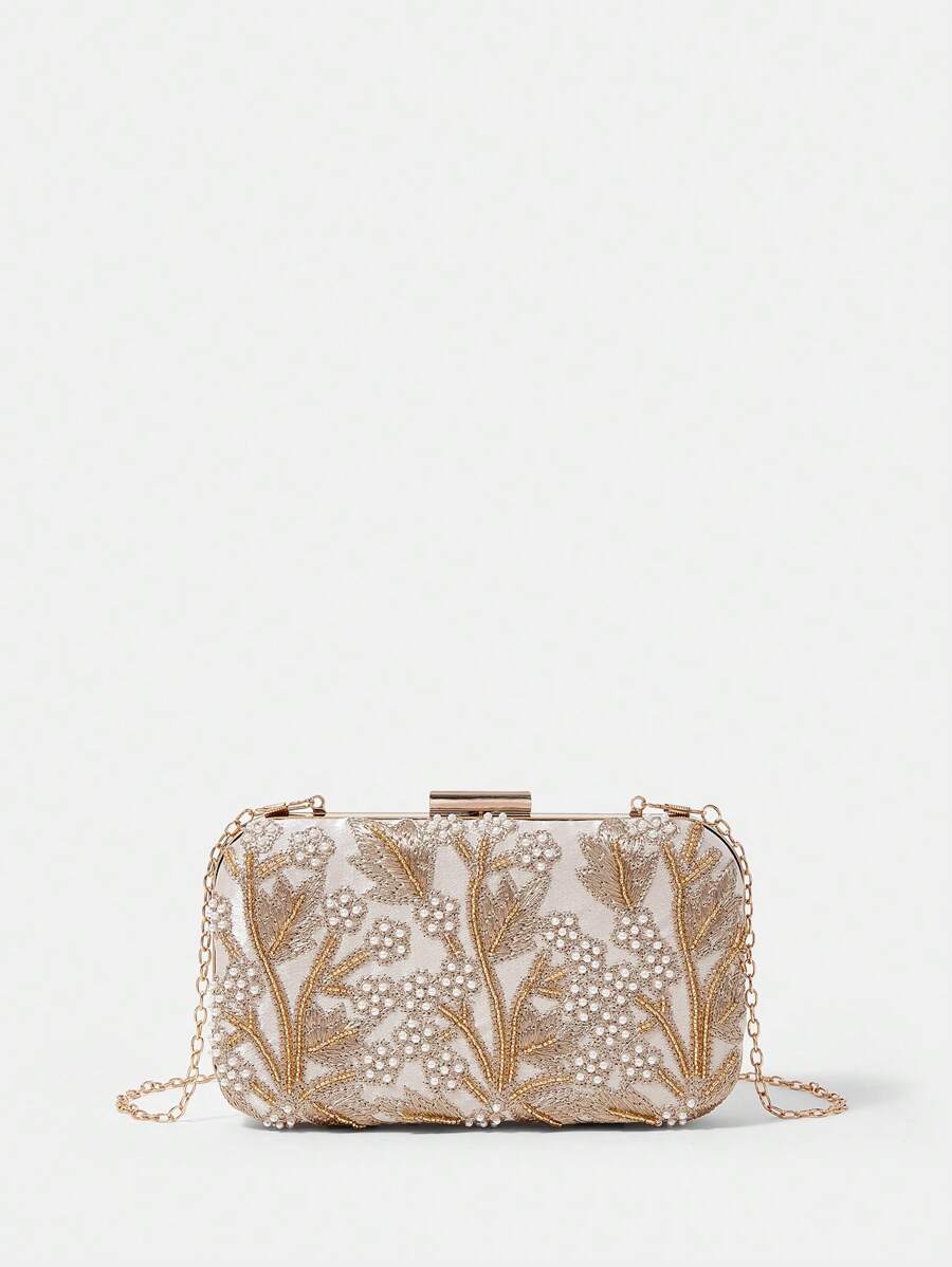 Add a touch of sparkle to your special night with this Elegant Silver Pearl Embroidered Evening Clutch Bag. Perfect for brides and unforgettable occasions, its shimmering pearls and delicate embroidery make it a charming companion for your essentials. Carry your style with a wink and a sparkle!